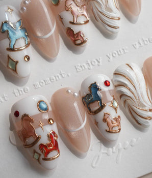THE REVERIE nostalgic carousel nails with pearl white base and colorful embossed horses
