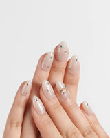 The Vow handmade press-on nails featuring Sheer Shimmering Glitter, Minimalist Silver Studs & Metallic Ring Accents.