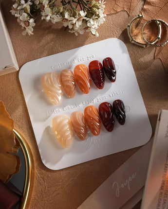 The Whole Fall nails with warm caramel color, ripple texture, and glossy autumn finish