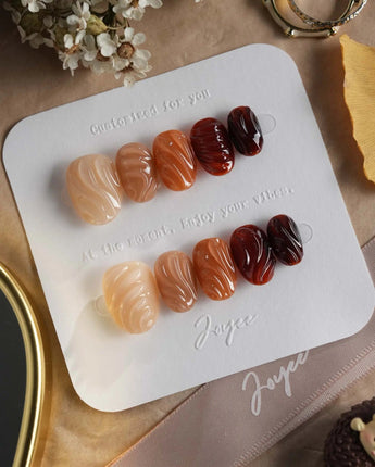 The Whole Fall press-on nails with syrupy amber tones and dimensional fall gel details