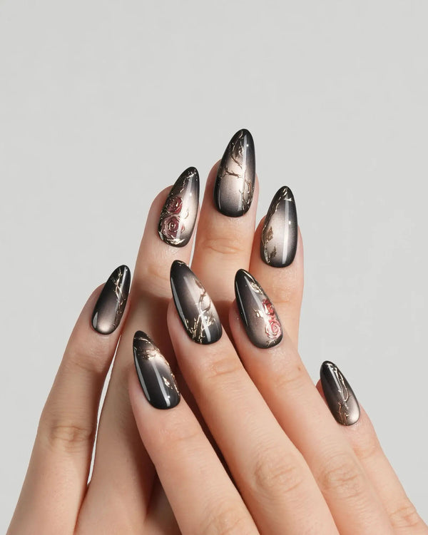 Handmade luxury nails with rose and thorn accents