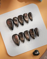 Thorned Spell press-on nails — black cat eye gold outline rose thorn design handmade nail art by Joyee Nails