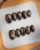 Thorned Spell press-on nails — black cat eye gold outline rose thorn design handmade nail art by Joyee Nails