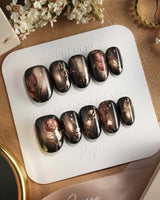 Thorned Spell press-on nails — black cat eye gold outline rose thorn design handmade nail art by Joyee Nails