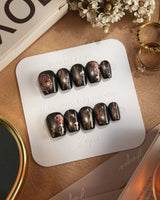Thorned Spell press-on nails — black cat eye gold outline rose thorn design handmade nail art by Joyee Nails