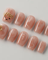 Thump Bunny extra short coffin press-on nails with peach heart cat-eye art