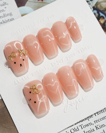 Thump Bunny short coffin press-on nails with glossy bunny-inspired cat-eye art