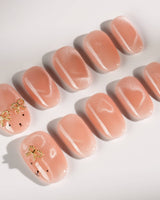 Thump Bunny short oval press-on nails with pink bunny and heart cat-eye glow