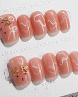 Thump Bunny short square press-on nails with peach cat-eye heart design