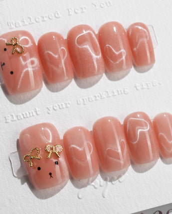 Thump Bunny short square press-on nails with peach cat-eye heart design