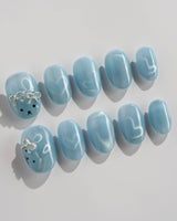 Thump Bunny_Macaron extra short oval nails with ice blue heart cat eye design