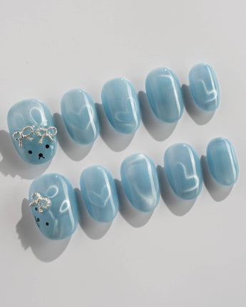 Thump Bunny_Macaron extra short oval nails with ice blue heart cat eye design