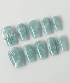 Thump Bunny_Macaron handmade press-ons with soft blue shimmer and heart magnet effect