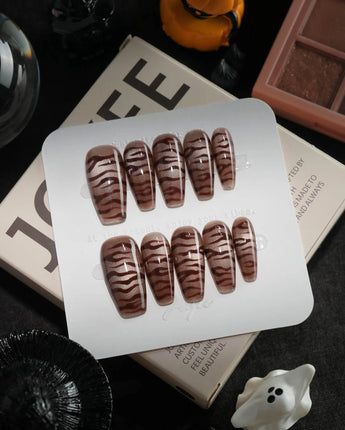 Tiger Eye handmade press-on nails in medium coffin shape by Joyee Nails
