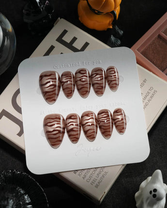Tiger Eye handmade press-on nails in extra short almond shape by Joyee Nails
