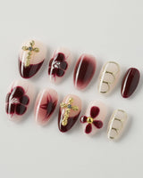 Tip Burgundy Nails in extra short almond shape with red French tips and floral cross details