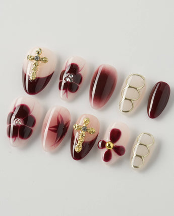 Tip Burgundy Nails in extra short almond shape with red French tips and floral cross details