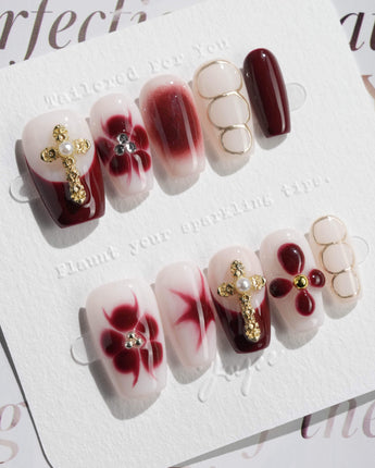 Tip Burgundy Nails in short coffin shape with glossy red tips and ornate fall nail art