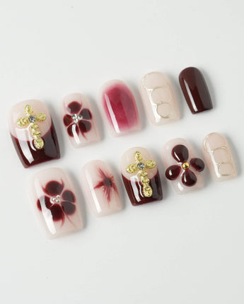 Tip Burgundy Nails in short square shape with burgundy French tips and floral gold details