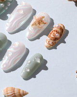 Mauritius Escape tropical conch shell nails with water-drop bubbles and pearl decor