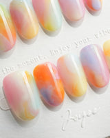 Tutti Frutti short oval nails with lemon, peach, pink, lilac, and mint gradients