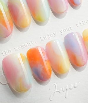 Tutti Frutti short oval nails with lemon, peach, pink, lilac, and mint gradients