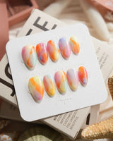 Tutti Frutti rainbow gradient press-on nails in extra short almond shape
