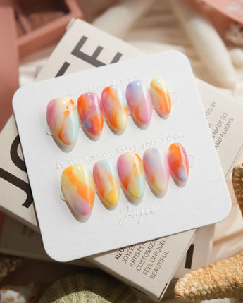 Tutti Frutti rainbow gradient press-on nails in extra short almond shape