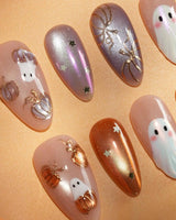 Twilight Pumpkin press on nails with chrome pumpkins, pastel ghosts and gold stars on lavender and copper cat eye - image 3