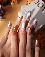 Twilight Pumpkin press on nails with chrome pumpkins, pastel ghosts and gold stars on lavender and copper cat eye - image 2