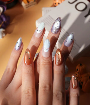 Twilight Pumpkin press on nails with chrome pumpkins, pastel ghosts and gold stars on lavender and copper cat eye - image 2