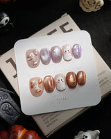 Twilight Pumpkin handmade press-on nails in extra short oval shape by Joyee Nails