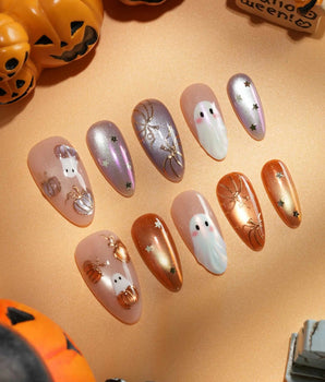Twilight Pumpkin press on nails with chrome pumpkins, pastel ghosts and gold stars on lavender and copper cat eye - image 1