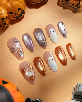 Twilight Pumpkin press on nails with chrome pumpkins, pastel ghosts and gold stars on lavender and copper cat eye - image 1