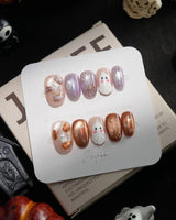 Twilight Pumpkin handmade press-on nails in short oval shape by Joyee Nails
