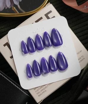Ultraviolet press on nails in bright violet cat eye with a thin silver chrome edge along the tip - image 2