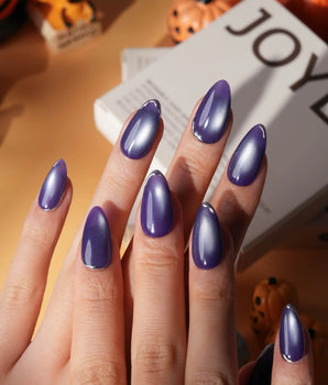 Ultraviolet press on nails in bright violet cat eye with a thin silver chrome edge along the tip - image 1