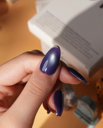 Ultraviolet press on nails in bright violet cat eye with a thin silver chrome edge along the tip - image 4