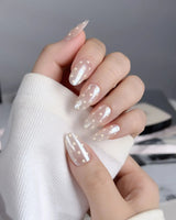 Lemon soda press-on nails with pearly aurora nude finish and creamy retro polka dot accents