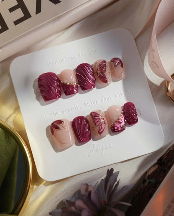 Velvet Flow extra short coffin press-on nails with red cat-eye shimmer and butterfly wings