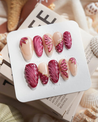 Velvet Flow medium almond press-on nails with deep red and burgundy fall nail art