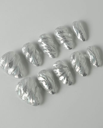 Velvet Frost press-on nails in extra short almond shape — 3D Spiral Texture, Silver Glitter Effect.