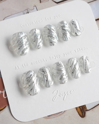 Velvet Frost press-on nails in extra short oval shape — 3D Spiral Texture, Silver Glitter Effect.