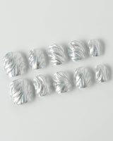 Velvet Frost press-on nails in extra short squoval shape — 3D Spiral Texture, Silver Glitter Effect.