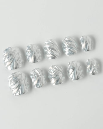 Velvet Frost press-on nails in extra short squoval shape — 3D Spiral Texture, Silver Glitter Effect.