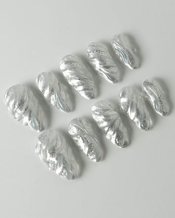 Velvet Frost press-on nails in medium almond shape — 3D Spiral Texture, Silver Glitter Effect.