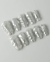 Velvet Frost press-on nails in medium coffin shape — 3D Spiral Texture, Silver Glitter Effect.