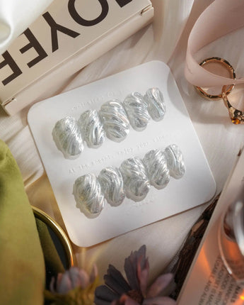 Velvet Frost press-on nails in short oval shape — 3D Spiral Texture, Silver Glitter Effect.