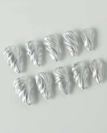 Velvet Frost press-on nails in short stiletto shape — 3D Spiral Texture, Silver Glitter Effect.