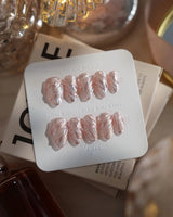 Velvet Twist press-on nails in extra short almond shape — Pink silver chrome swirl 3D sculpted glitter overlay